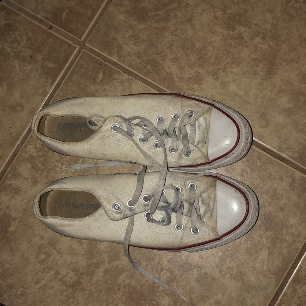 A pair of worn converse